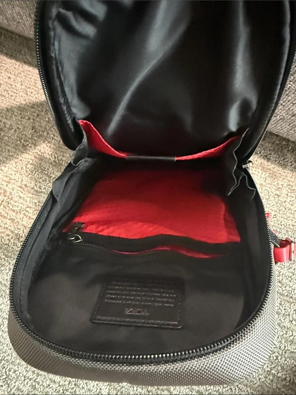Tumi Gray Sling Bag with Red Accent- NEVER USED OR WORN. Tags removed, A gift